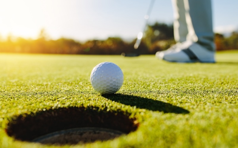 a golf ball on a putting green